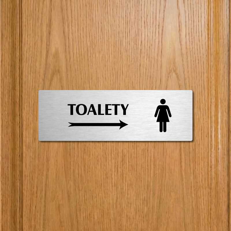 Toalety vpravo ženy, 240x79mm, stříbrná popiska 